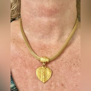Costume gold chain with heart pendant.